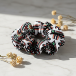 Folkstar Parzenica folk scrunchie on marble surface with dried wildflowers