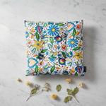 Folkstar Kashubian folk pillow on marble surface with dried wildflowers