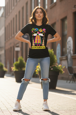Young woman wearing Folkstar Pracowita Kobita black t-shirt in a sunny outdoor setting