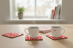 Folkstar Polish Symbols cork coasters on a light wooden kitchen table with white ceramic mugs