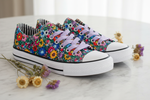 Folkstar Opole folk sneakers on marble surface with dried wildflowers